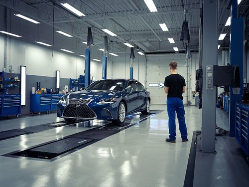 Technician doing estimate on a Blue Lexus IS-Lexus Collision Repair Technician doing estimate on a Blue Lexus IS-Lexus Collision Repair